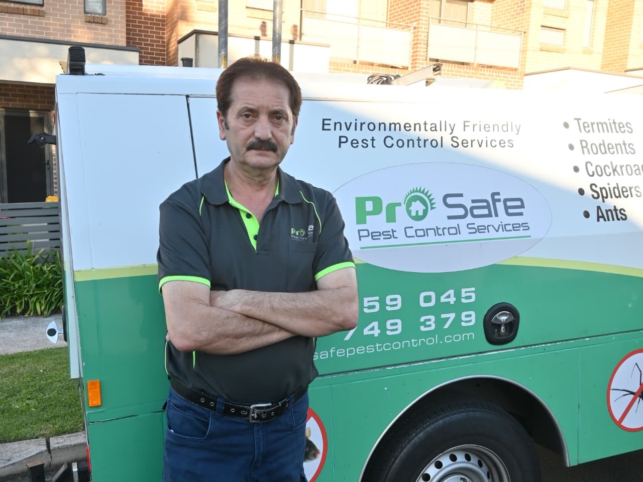 ProSafe technician standing in front of a pest control service vehicle